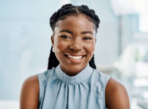 Confident black businesswoman working in an office alone
